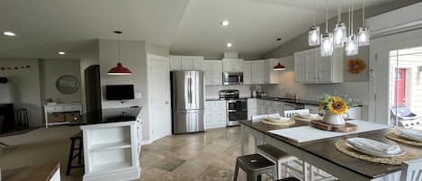 Large kitchen, fully stocked with all of your kitchen needs. 