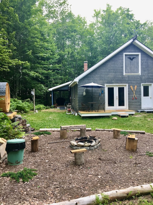 The Canoe House Bungalow and Fire Ring out front.