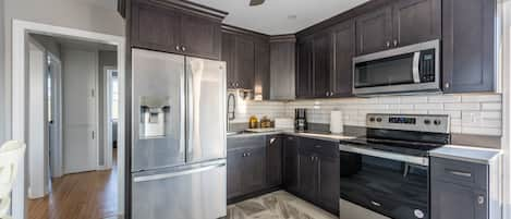 Brand new gourmet Kitchen with Quartz countertops