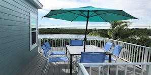 Large deck on front side of house with spectacular views of Pine Channel