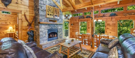 Beautiful, custom wood carvings surround you in this luxury cabin! Open concept!