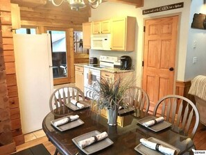Dinning area features a bench and four chairs
