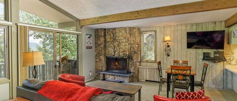 You will enjoy this comfortable living space where you can relax by the wood burning fire or play a game of cards.