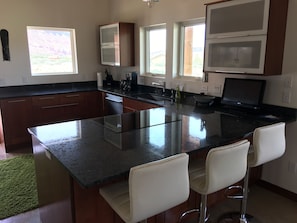 Large kitchen with granite countertops