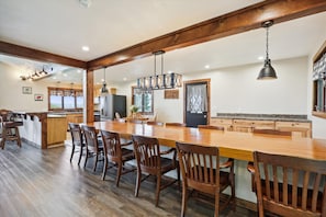 Large, custom made dining table, with seating for up to 14