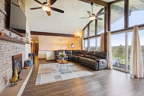 Spacious living room with large TV