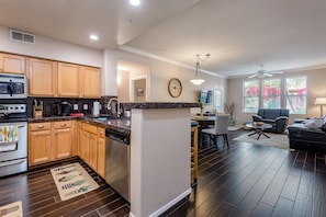 Kitchen opens to living room.