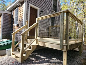 We have a brand new deck of the back facing the woods for our guests to enjoy!