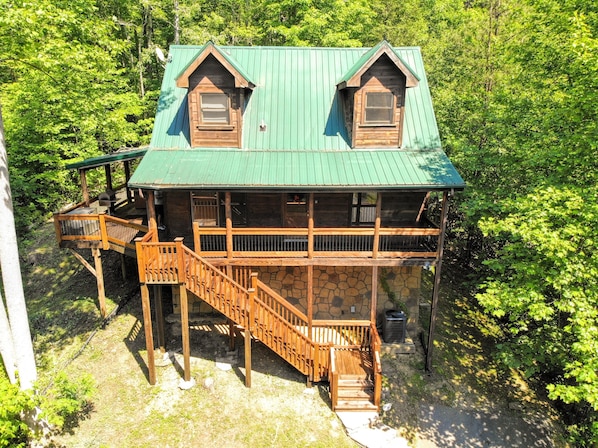 Spacious covered decks, a new hot tub and over an acre of land - can't be beat!