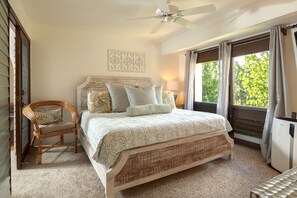 The primary bedroom has AC, a king-sized bed, and a tv.