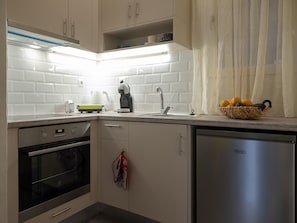 Kitchen with builty in Oven Hobs and refrigirator