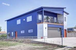 Outside view, The left red door is the entryway.