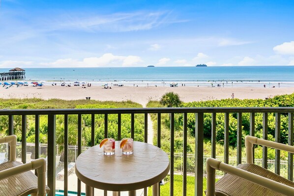 Stunning ocean and Cocoa Beach Pier view from your private balcony—perfect for morning coffee.