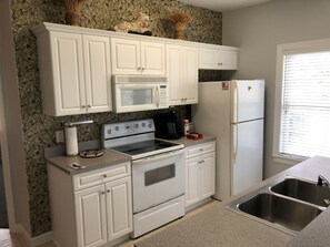 Full size kitchen with dishes, flatware, pots & pans available. 