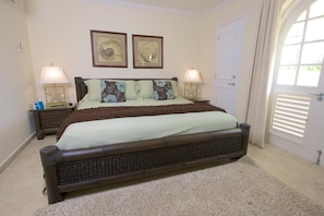 The master bedroom with a comfortable queen bed, air-conditioning and en suite bathroom