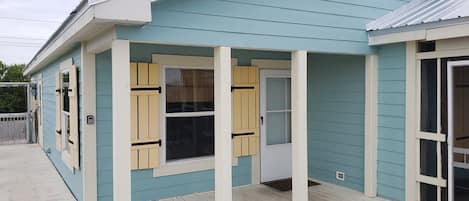 The front porch which faces the lake.