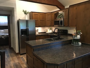Complete kitchen with plenty of cupboards to store your needed food items.