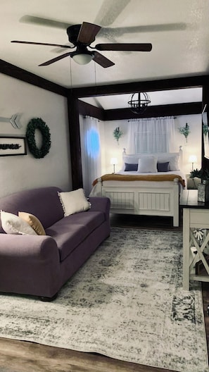 Second bedroom located in lower level. Has own couch and television.