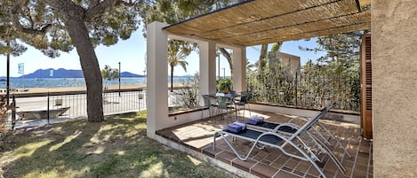 Private terrace of the apartment with direct access to the sea.