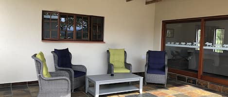 Spacious, private Stoep  with comfortable chairs and braai