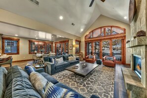 Easily flow between the living room and the kitchen area without ever losing sight of the lake and all of its glory. Perfect for family gatherings like playing cards or catching the game on the big screen.