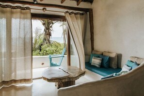 Casa Gaia sitting area with doors to the sea