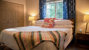 Main bedroom located on the second level boasts a spacious king-sized bed