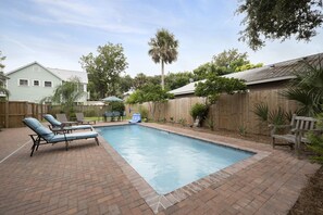 Heated Saline Pool with Waterfall and planty of seating. 