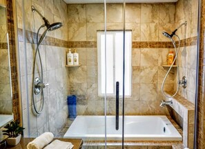 Oasis bathroom with dual shower