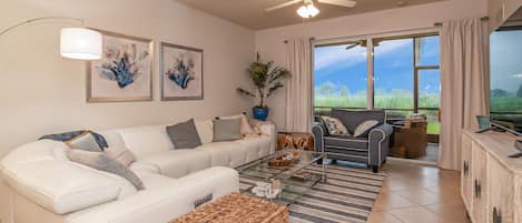 Living room looking out over the lanai. 