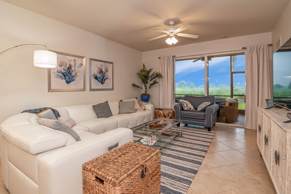 Living room looking out over the lanai. 