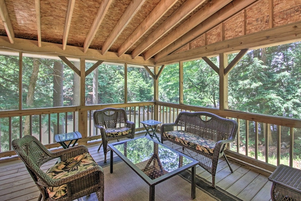Sit back and relax in the forest at this Weare house!
