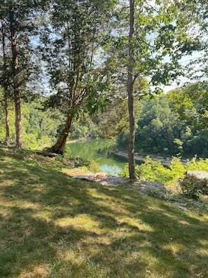 Backyard has water views, fire pit, gas grill, and 2 decks to enjoy the outdoors