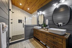 Master Ensuite:Refresh and recharge in the master bathroom oasis, complete with a roomy walk-in shower and a lavish soaking tub for ultimate relaxation.