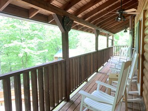 Rocking chairs on the private deck facing the mountains