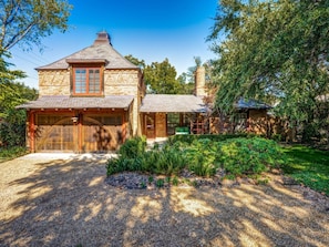 Front of home & Gravel driveway