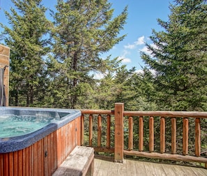 The hot tub is located on the 2nd floor balcony.