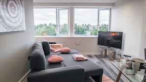Living Room with Sofa Bed, Smart TV including Netflix and 4 Seater Dining Table