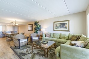 Open Concept Living Area leads to Dining Table and Kitchen