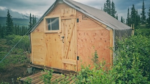 the front of the tent - wooden front, sturdy against the elements. 