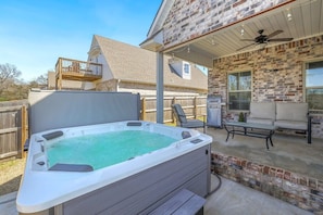 Out back enjoy our newly added hot tub spa!