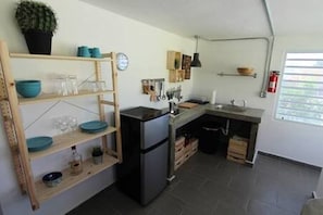 Your kitchen area with wall mounted rack for your dishes