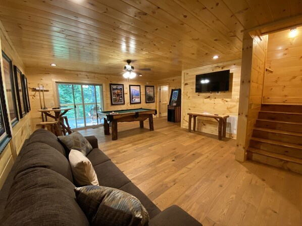 Comfortable game room. Fold out couch, pool table, lots of board games, arcades.