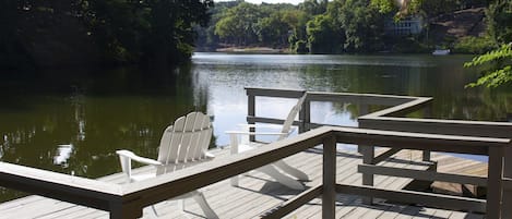 Private dock on Lake Avalon with two kayaks and a paddleboat