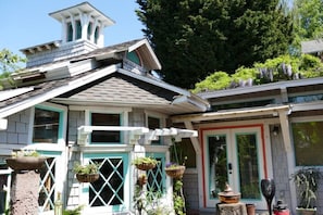 View of cottage from garden patio.
