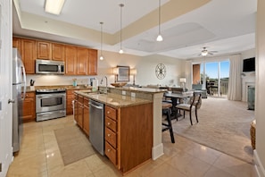 Fully equipped kitchen with stainless steel appliances and granite countertops