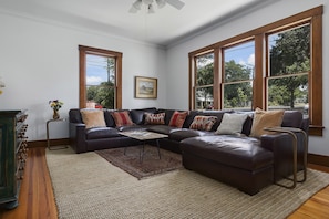 Living room showing the new leather sectional sofa.