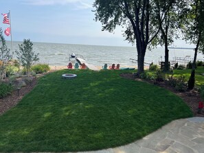 View of the yard and lake from the deck.