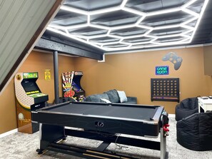 Fun for the whole family! Play pool, ping pong, or air hockey, and dive into hours of entertainment with the Infinity Game Table and arcade classics. Kick back in the comfy bean bags, challenge your friends to Giant Connect 4, or get nostalgic with SNES. Plus, there’s a cozy book nook for quiet moments after the action!