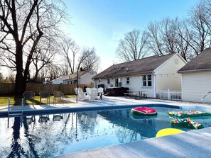 Enjoy the ultimate relaxation with poolside vibes, a soothing hot tub, and a cozy fire pit. Whether you're playing backyard games, grilling your favorite meal, or just lounging under the twinkling lights, this space is your perfect escape for a wonderful retreat.